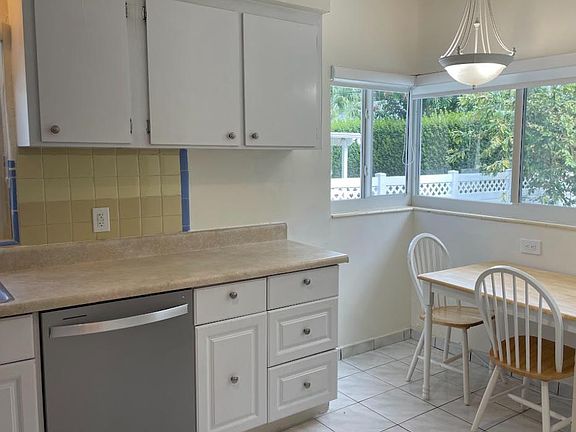 breakfast nook with view of backyard