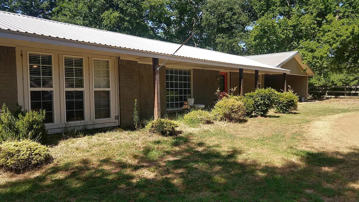 Front of House with attached storage building and 2 car covered Breezeway - 805 Harkey St
