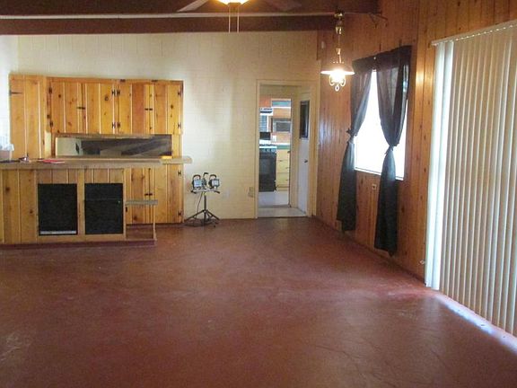 living room, door faces kitchen, floor just painted cream co