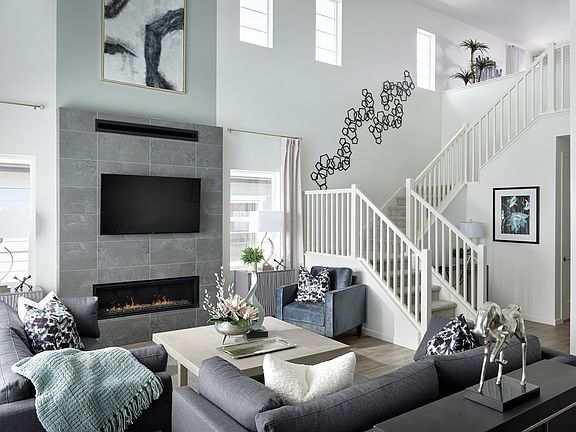 Great Room with Fireplace and Stairway