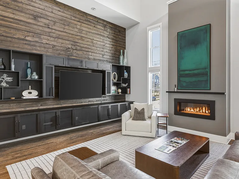 Bright, modern living room with abundant natural light, plush seating for everyone, a cozy gas fireplace, and a Smart TV_perfect for relaxing after a day in Nashville.