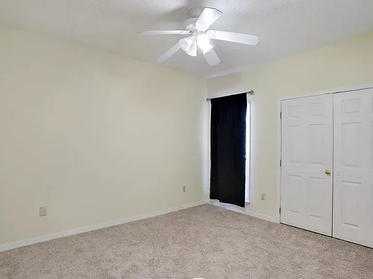 Front bedroom #1
Window, new carpet, ceiling fan, closet