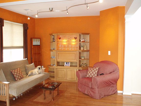 living room with hardwood floor & custom light fixture