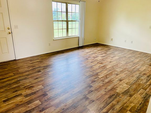 Living room with new wooden floors and new paint throughout the home