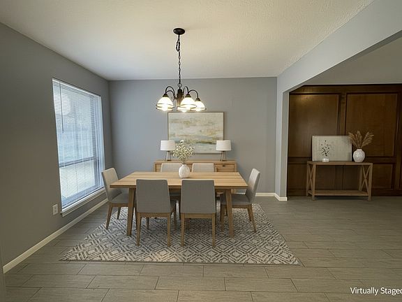 The dining room and partial beautiful Oak wall of the living room.