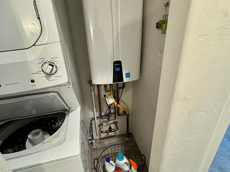 Upstairs washer and dryer. On demand tankless water heater.