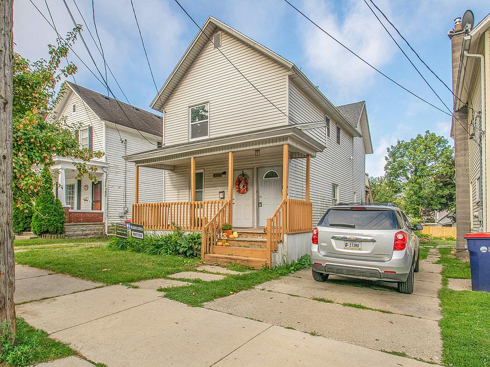 Front of the duplex, upper unit entry door is the right front door.