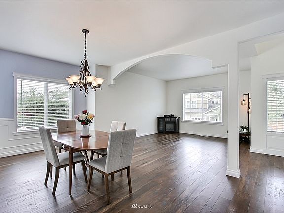 View of dining and formal living room. >