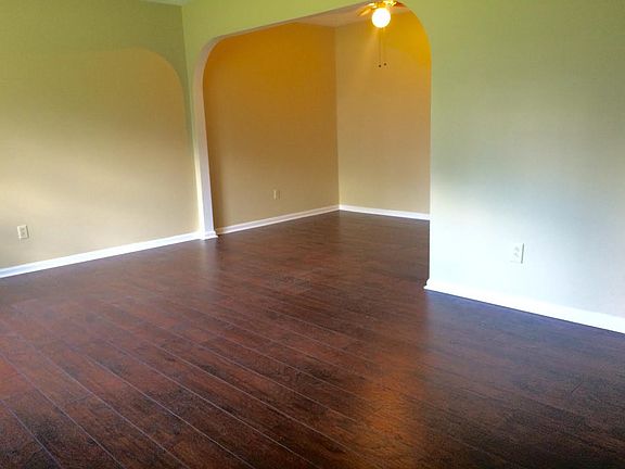 Dining Room, with new hardwood floors & arched doorways