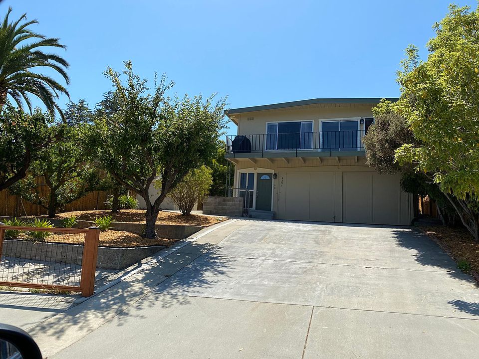 Fruit trees, easy care landscaping, plenty of parking