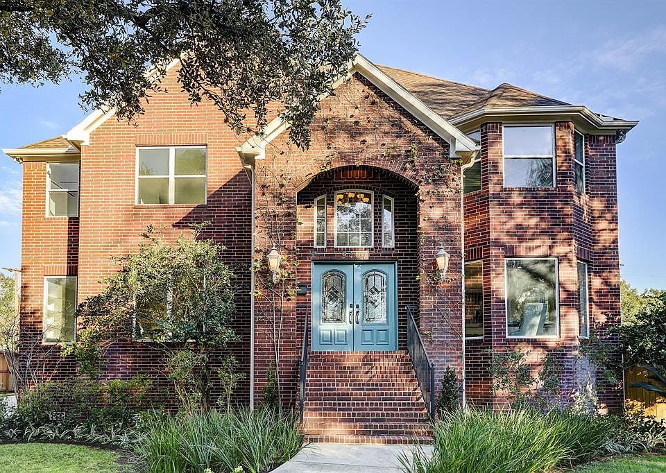 Impressive front elevation this brick traditional was built in 2004 on a 12,000+ square-foot lot on a quiet cul-de-sac in popular Meyerland.