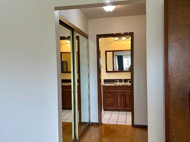 Primary bedroom with pass through closet and attached bathroom