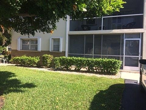 Front Shot of Bonus Room With Glass Sliders. Windows Have Accordion Hurricane Shutters