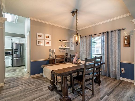 Formal living room with updated light fixture.