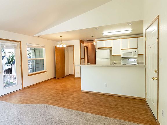 Upstairs Unit - Open Kitchen, Living Room, Dining Area, Entry, Balcony, Vaulted Ceilings