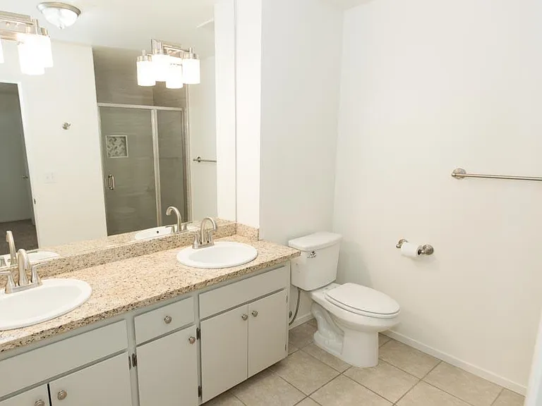 Double sink with LED lighting and granite counter top