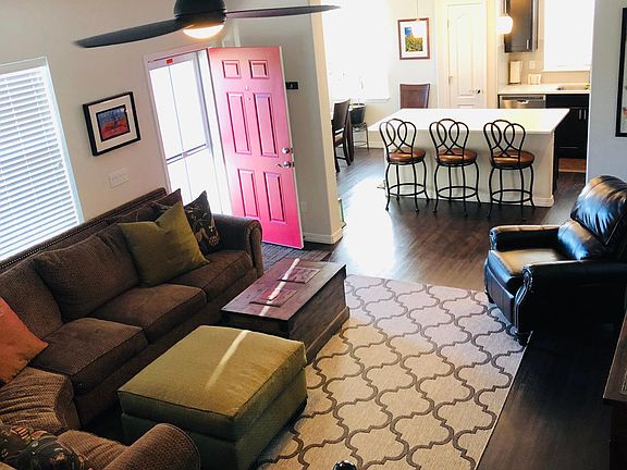 Large family room with wraparound couch.