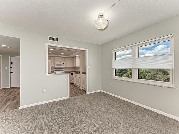 Looking back at Entry way and Kitchen