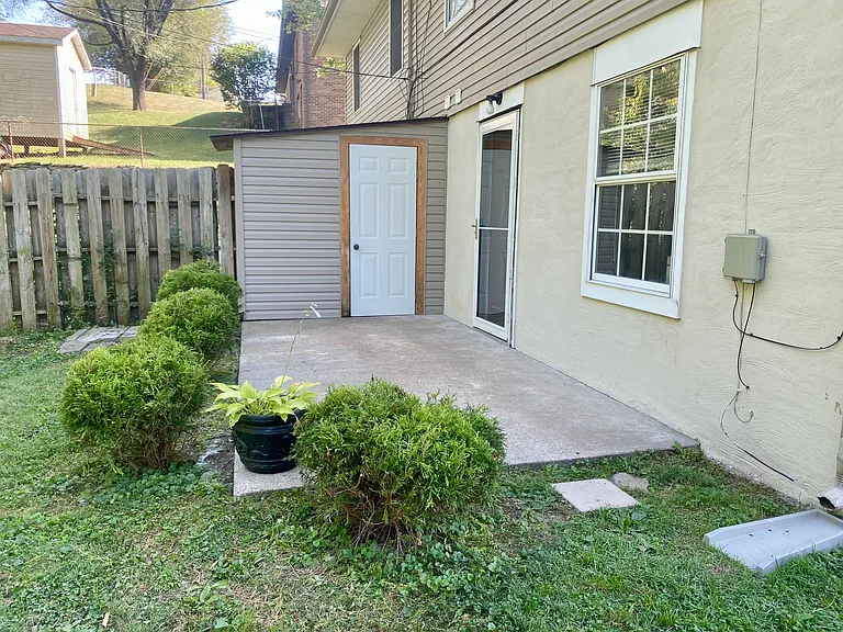 Back Patio with attached outdoor Storage Room