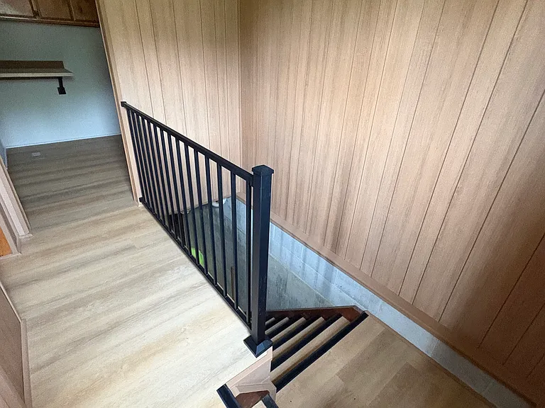 back porch, stairwell to basement and main level 1/2 bathroom