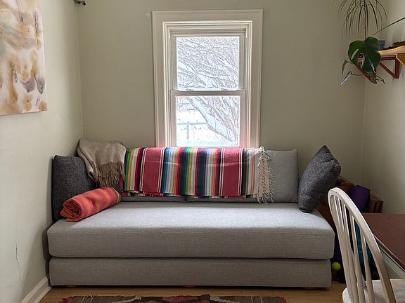 small bedroom with fold out couch