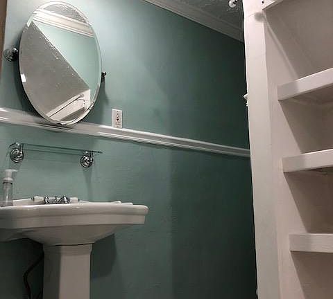 Bathroom with built-in shelving
