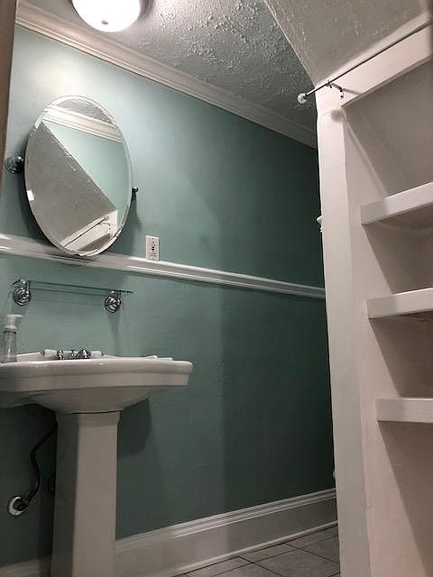 Bathroom with built-in shelving