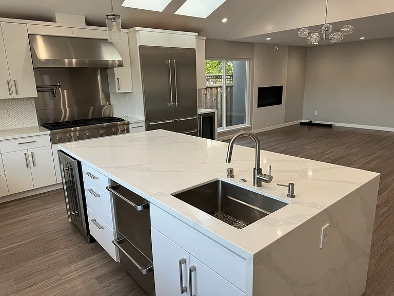 Large island with prep'sink, Fisher Paykel shelf dishwasher and wine fridge.