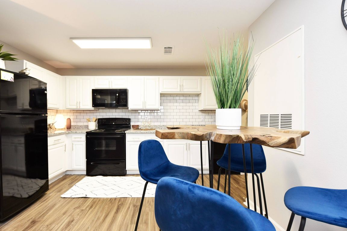 Kitchen with Backsplash + Modern Cabinetry