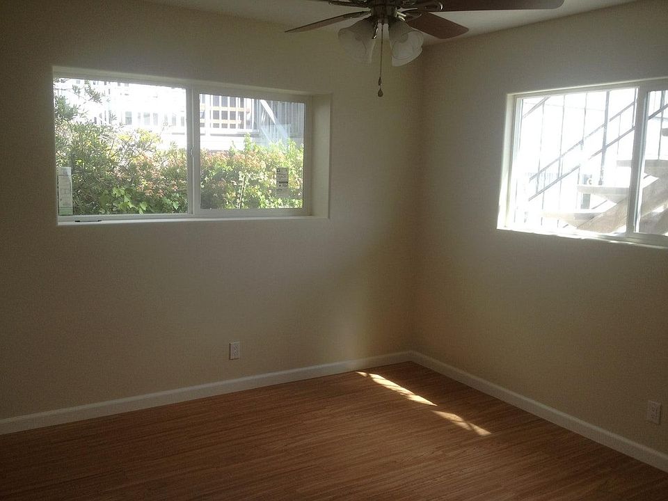 bedroom with plenty of natural light, fan and large reach in closet