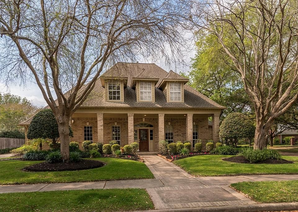 Welcome to Heather Valley Way. This columned Traditional home is a rare find!