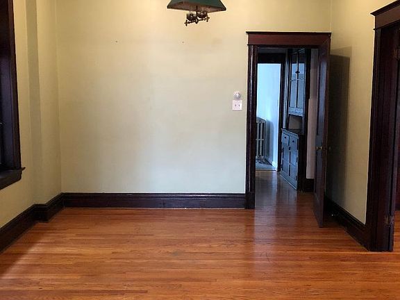 Dining Room with boxed ceiling, original lighting, and stain glass windows..