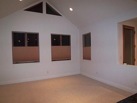 Living room with vaulted ceilings and great windows and ligh