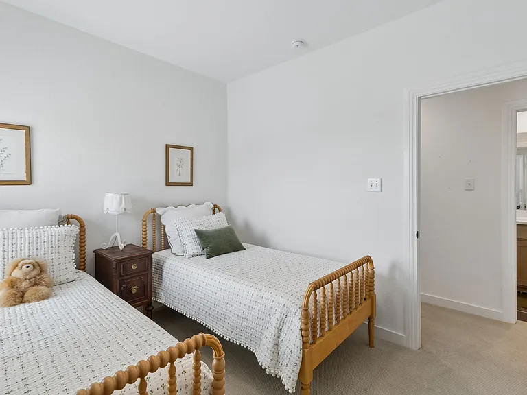 Second upstairs bedroom with two twin beds.