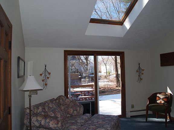 Family room with skylight and access to deck