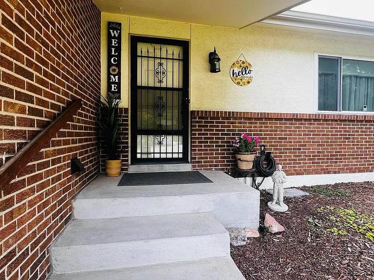 Well-lit shared front entrance.