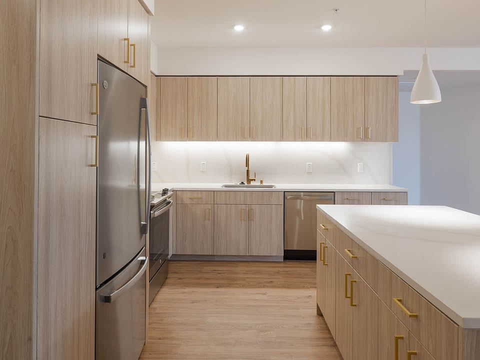 Kitchen with Stainless Steel Appliances and Quartz Countertops