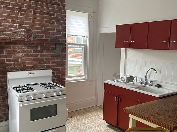 gas stove, nice double sink, large pantry, windows over garden, room for kitchen table, 11' x 13'
