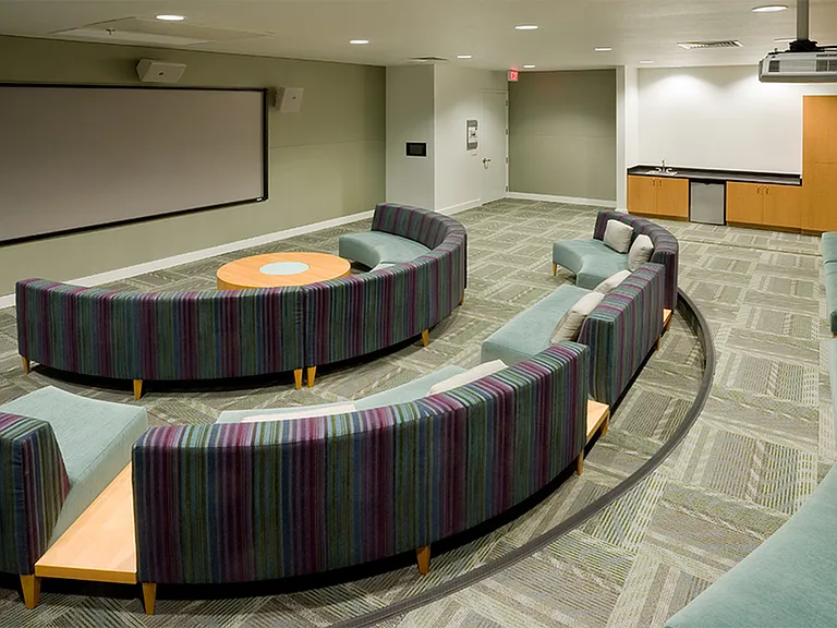 Catch a game or movie on the giant projector screen in our theater room