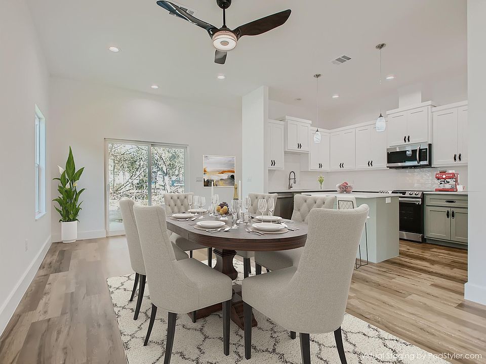 Open floor plan to kitchen, dining and living area (with virtual staging)