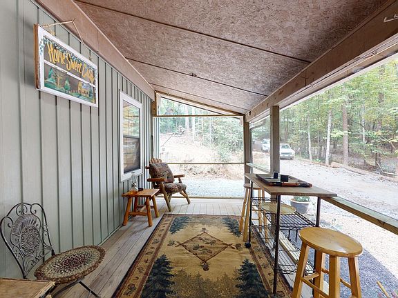 Sip coffee and watch the deer go by from the large screened porch