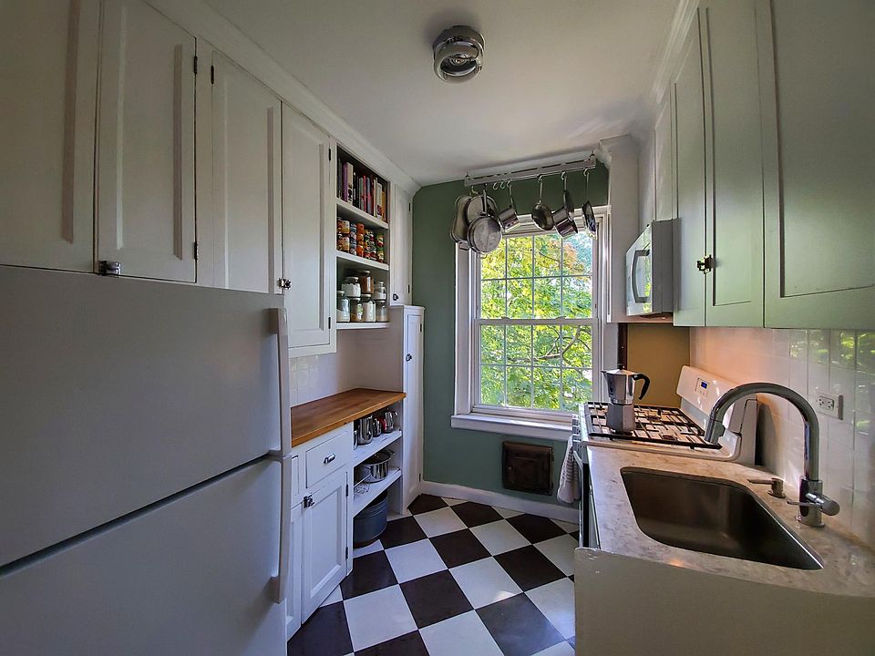 Kitchen recently updated with new dishwasher, cabinets, tile backsplash, countertop and extra deep undermount sink.