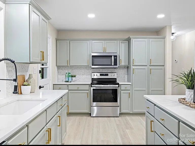 Plenty of cabinets for kitchen and pantry storage.