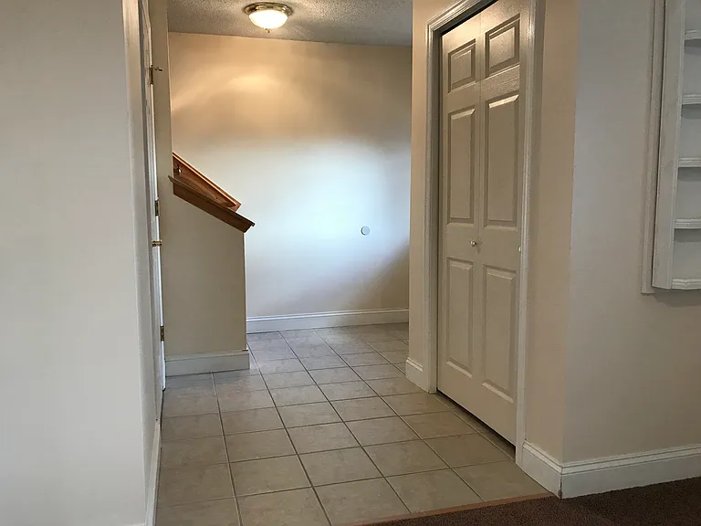 Entry Way. 1/2 bath on the left and Coat Closet on the right.