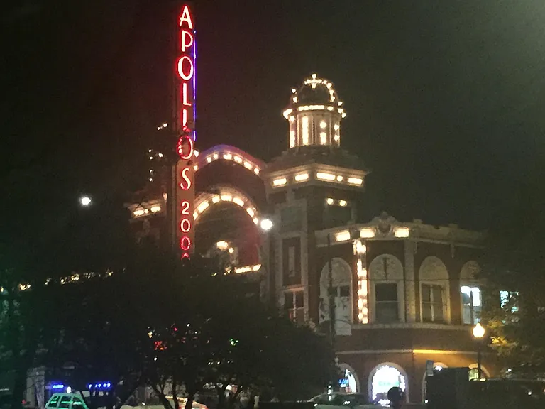 At the corner this century-old theater dating to the vaudeville era lights up the night.