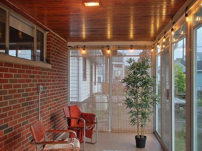3 season room overlooking private backyard.