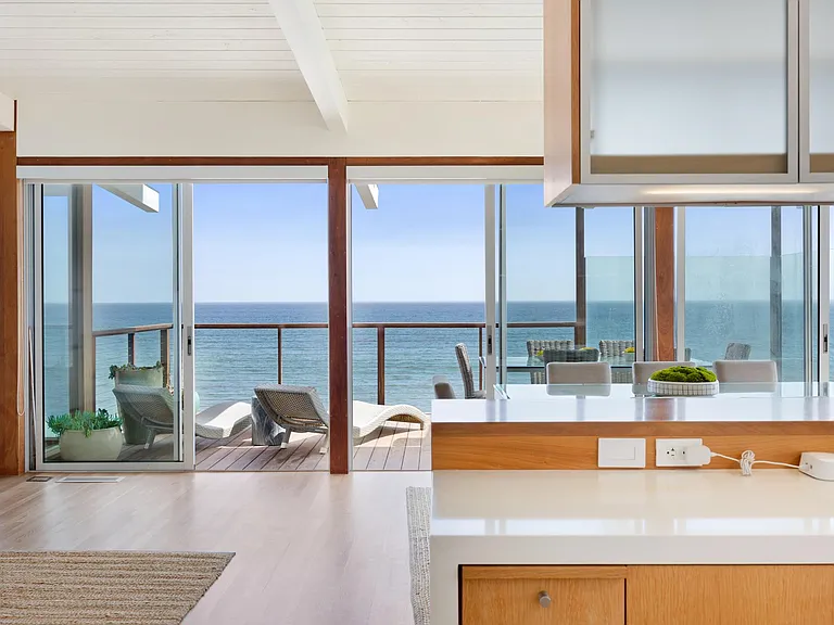 Open the large glass doors and let the fresh ocean air flow inside.