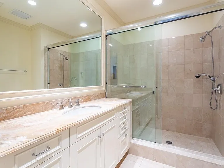 Ensuite Guest Bath has Crema Marfil and Breccia Oniciatta marble