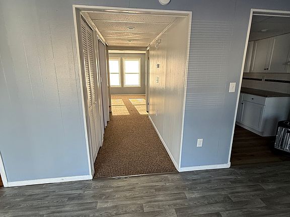 Hallway, Closet on your left along with furnace too. Half bath on your right.