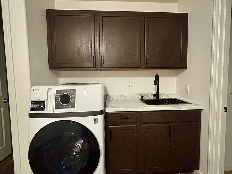 Kitchen cabinets, washer/dryer.